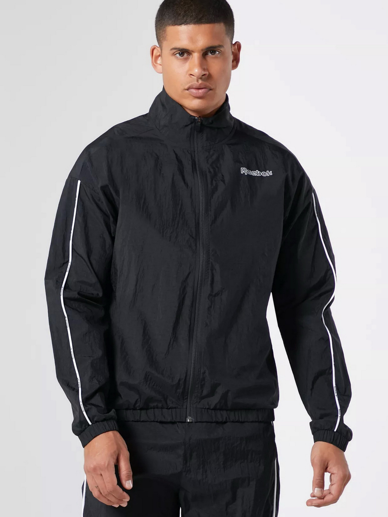 Спортивный костюм Reebok Training Essentials Piping Track модель GS9309 Фото