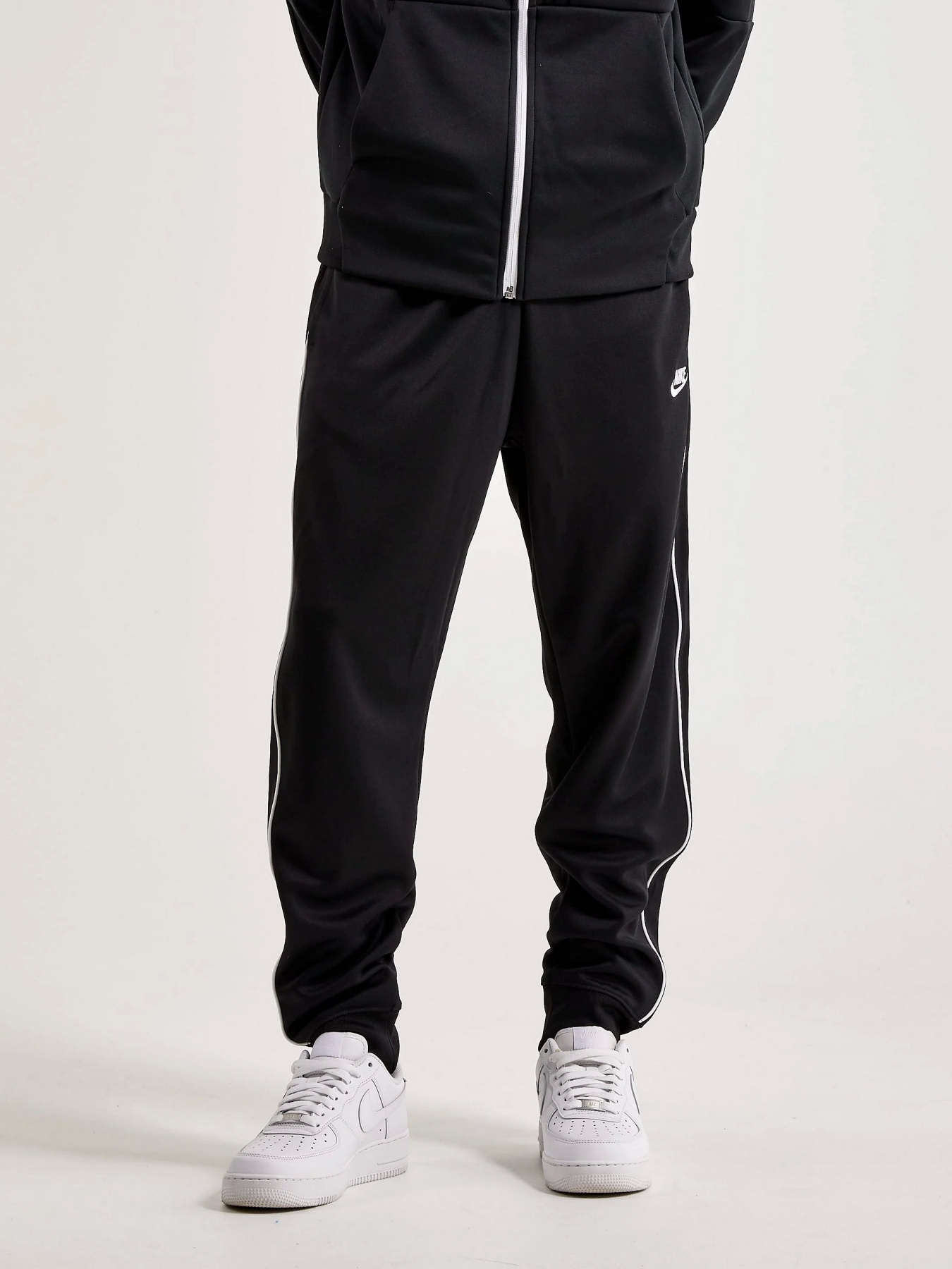 Штаны спортивные NIKE M NK CLUB PK PANT модель DX0615-010 Штаны спортивные NIKE M NK CLUB PK PANT модель DX0615-010 Фото