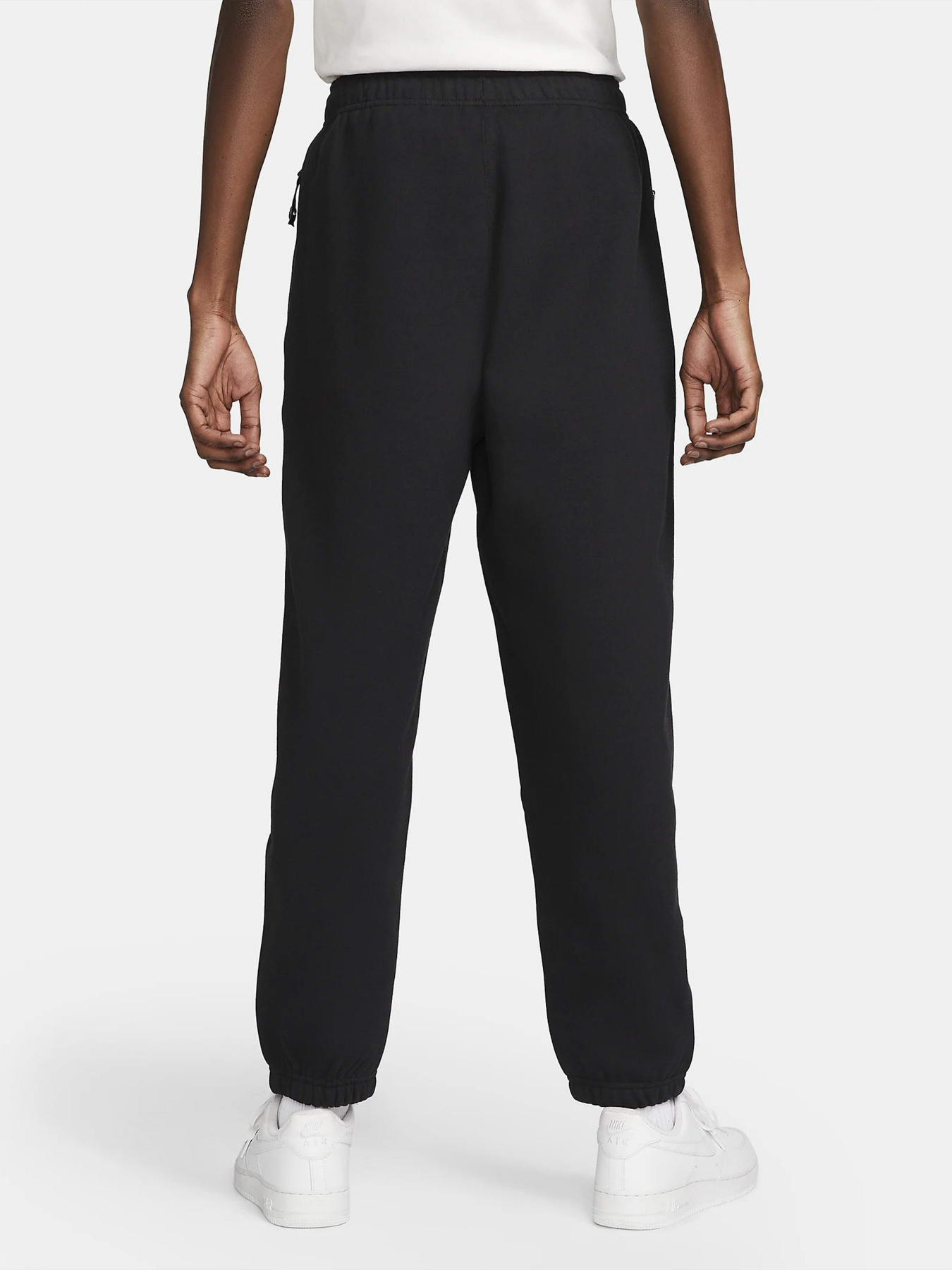 Штаны спортивные NIKE Solo Swoosh Fleece модель DX1364-010 Штаны спортивные NIKE Solo Swoosh Fleece модель DX1364-010 Фото