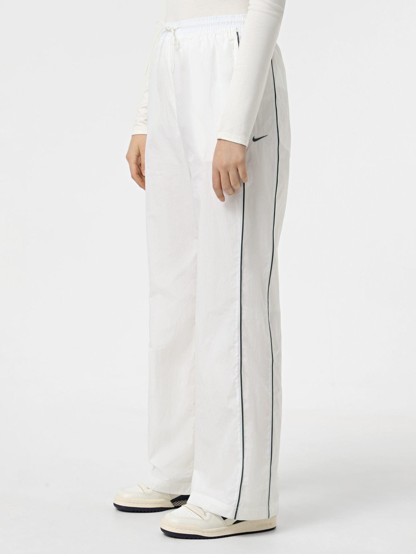 Штаны спортивные NIKE WINDRUNNER модель FV7655-134 Фото