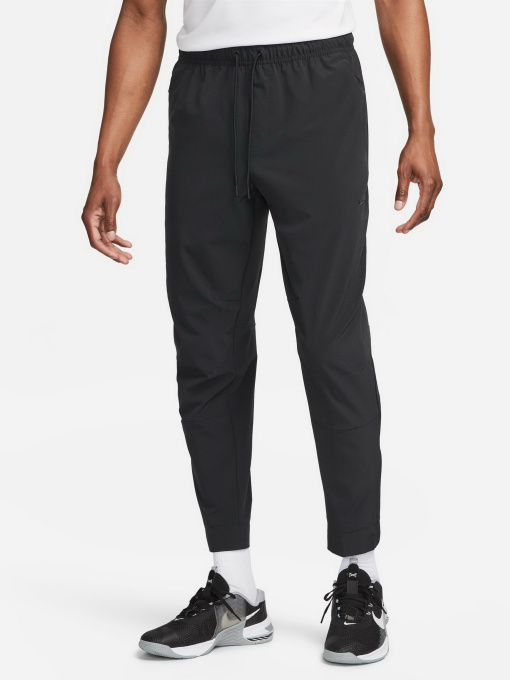 Спортивні штани NIKE DRI-FIT UNLIMITED PANT TAPERED модель FB7548-010 Фото
