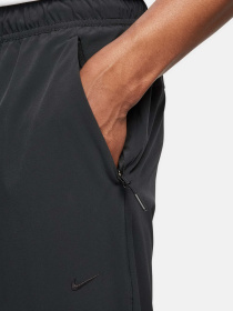 Штаны спортивные NIKE DRI-FIT UNLIMITED PANT TAPERED модель FB7548-010 Фото