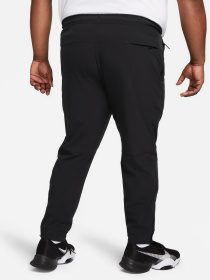 Штаны спортивные NIKE DRI-FIT UNLIMITED PANT TAPERED модель FB7548-010 Фото