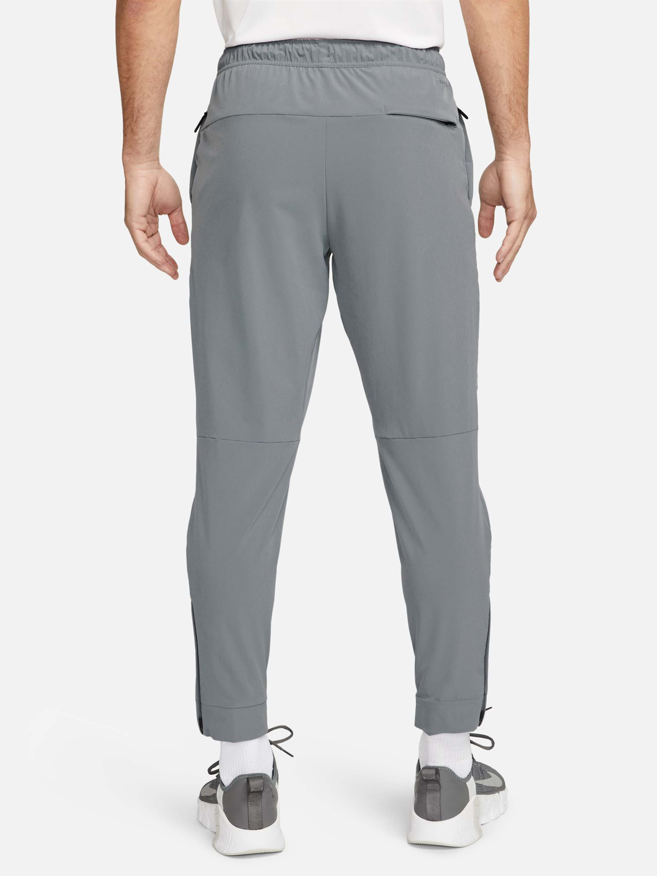 Штани спортивні NIKE Dri-Fit Unlimited Tapered Leg Versatile Training модель FB7548-084 Фото