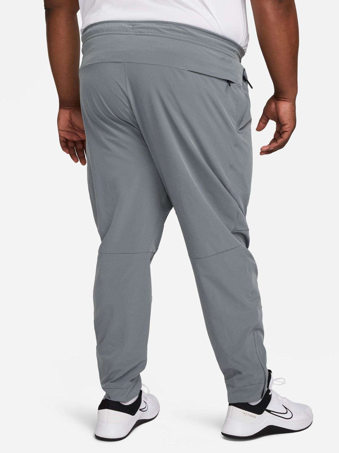Штани спортивні NIKE Dri-Fit Unlimited Tapered Leg Versatile Training модель FB7548-084 Фото
