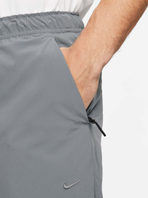 Штани спортивні NIKE Dri-Fit Unlimited Tapered Leg Versatile Training модель FB7548-084 Фото