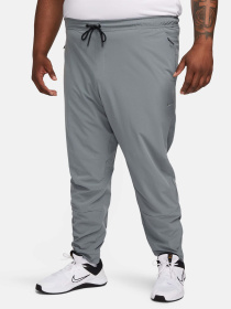 Штани спортивні NIKE Dri-Fit Unlimited Tapered Leg Versatile Training модель FB7548-084 Фото