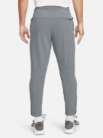 Спортивні штани NIKE DRI-FIT UNLIMITED TAPERED LEG модель FB7548-084 Фото