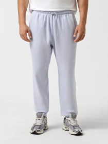 Штаны спортивные NIKE CLUB MEN'S CUFFED BRUSHED FLEE модель FN3808-057 Фото