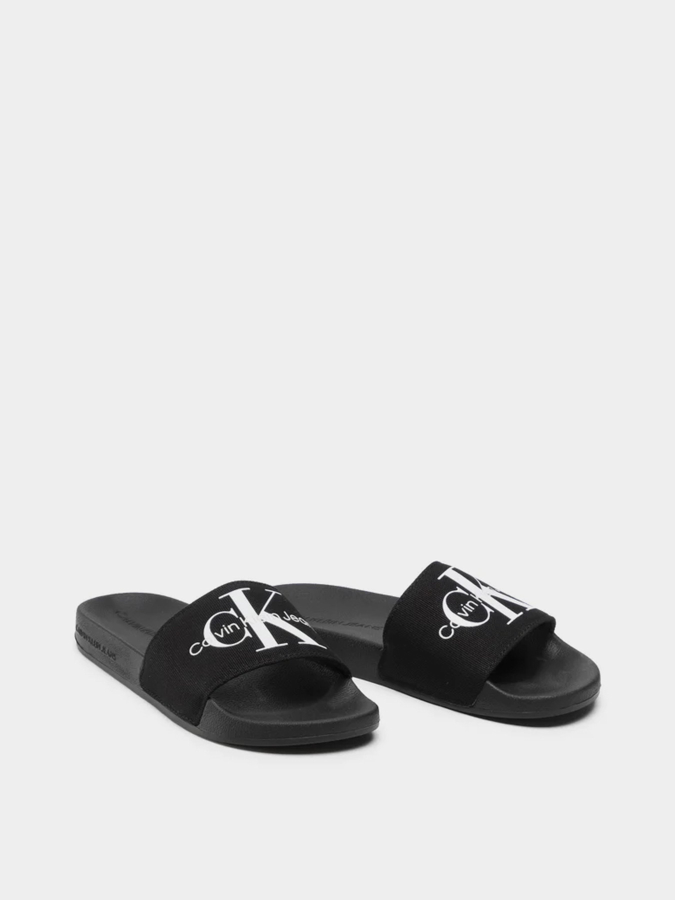 Шлепанцы Calvin Klein Slide Monogram Co модель YW0YW00103-BDS Фото