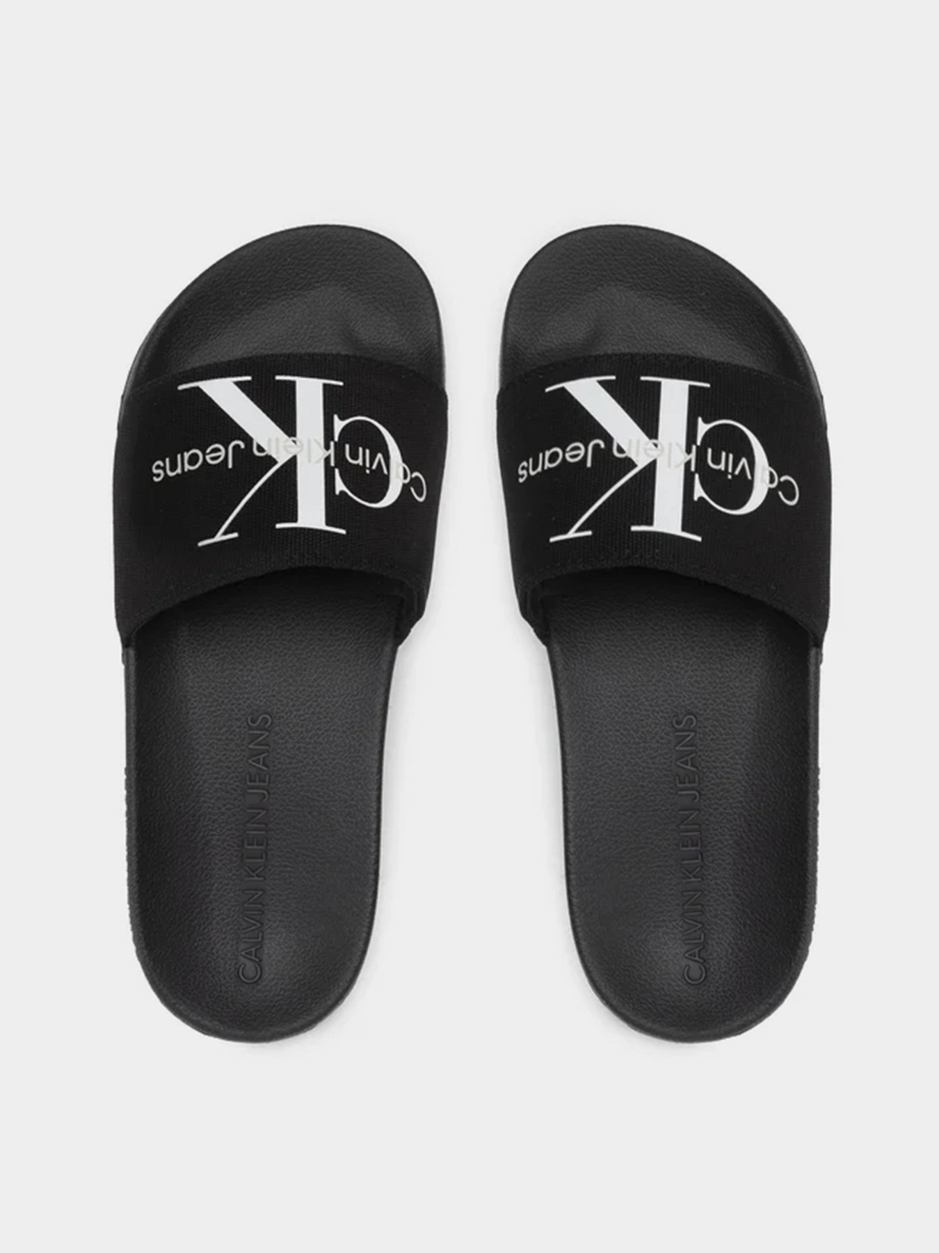 Шлепанцы Calvin Klein Slide Monogram Co модель YW0YW00103-BDS Фото