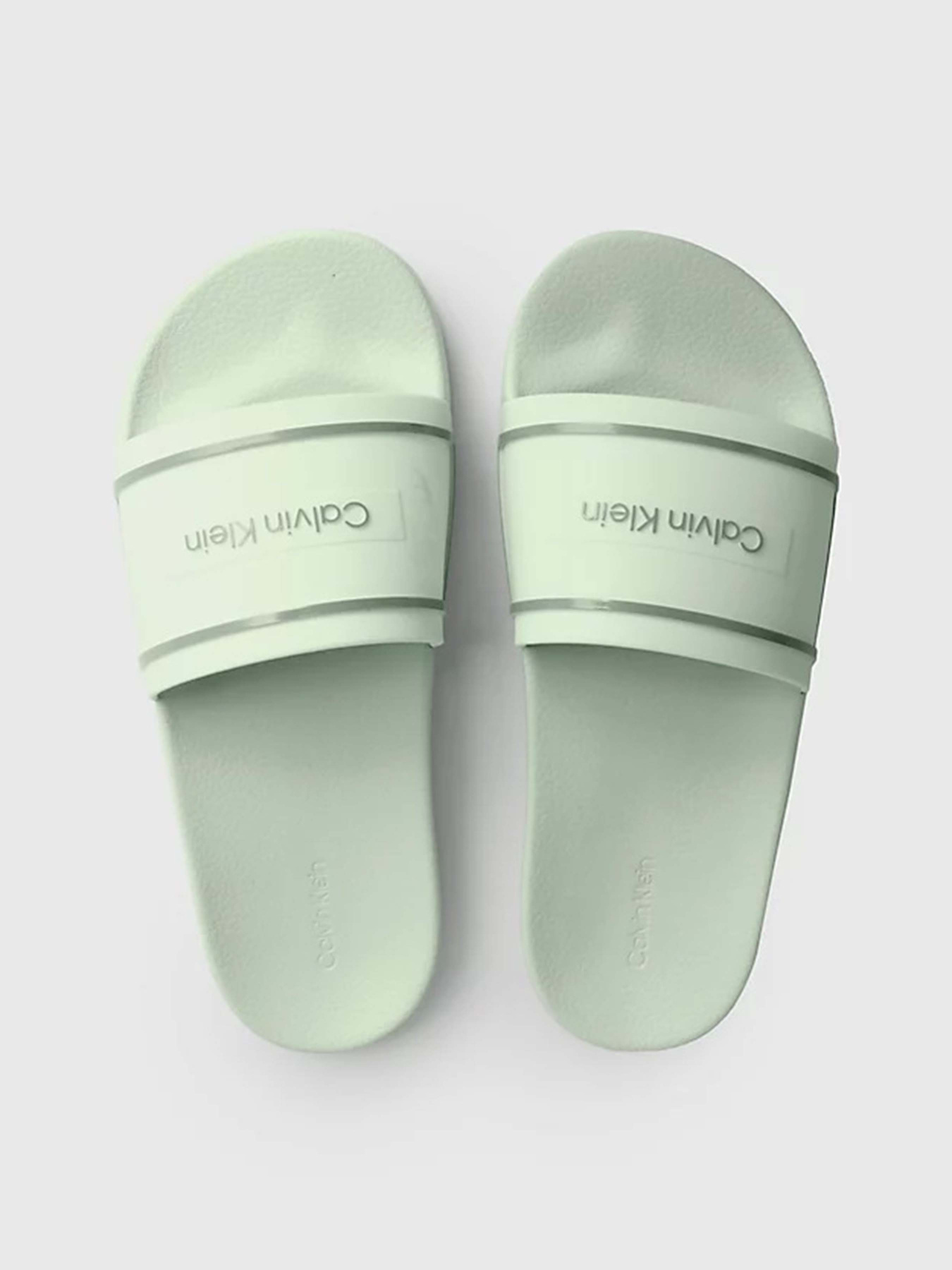 Шльопанці Calvin Klein Pool Slide Deboss Logo Tpu Модель HW0HW01976-LIA Фото