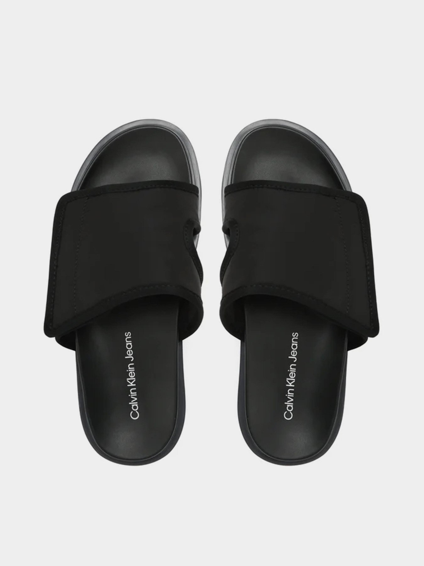 Шлепанцы Calvin Klein Sandal Slide Softny модель YM0YM00644-0GP Шлепанцы Calvin Klein Sandal Slide Softny модель YM0YM00644-0GP Фото