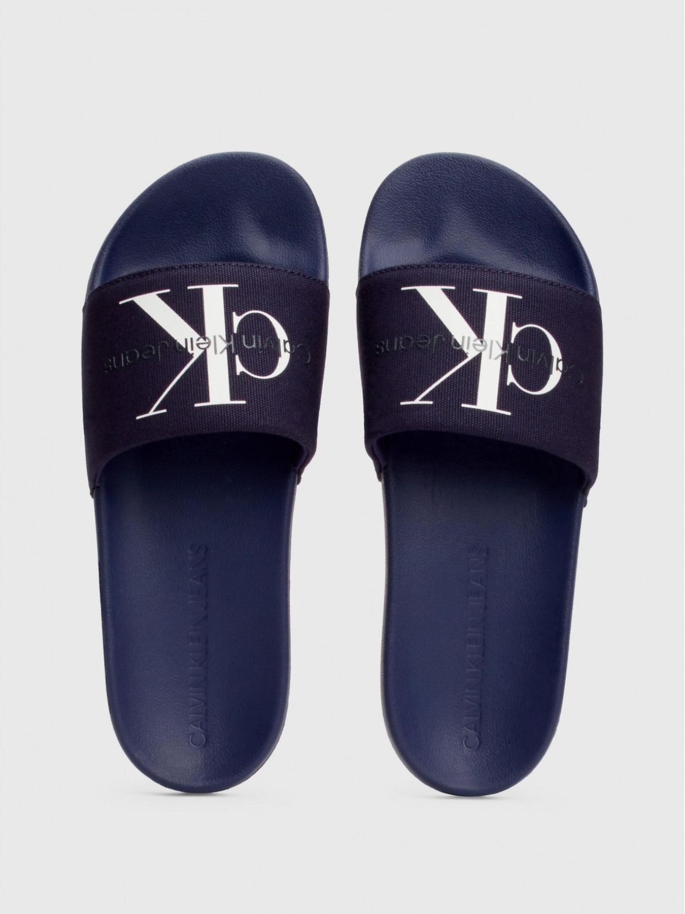 Шлепанцы Calvin Klein Slide Monogram Co модель YM0YM00061-0GY Фото