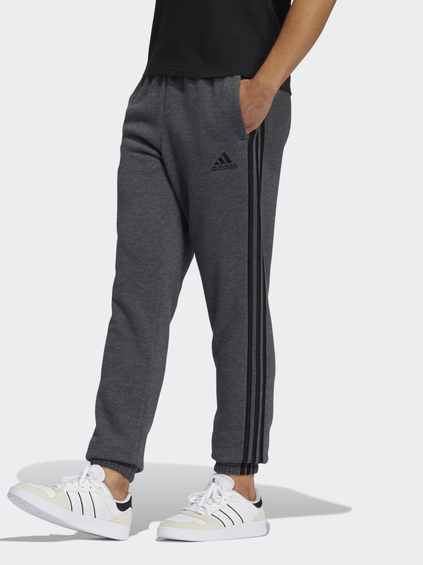 Штани спортивні Adidas ESSENTIALS FLEECE TAPERED ELASTIC CUFF 3-STRIPES модель GK8891 Фото