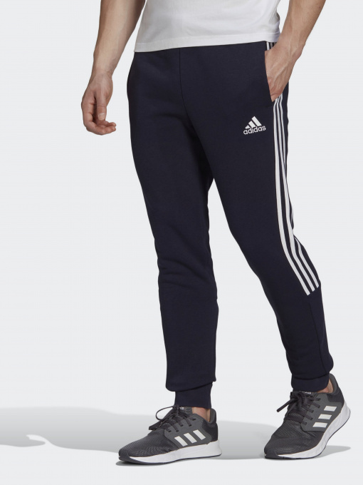 Штаны спортивные Adidas ESSENTIALS FLEECE TAPERED CUFF 3-STRIPES модель GK8977 Фото