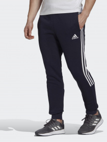 Спортивні штани Adidas ESSENTIALS FLEECE TAPERED CUFF 3-STRIPES модель GK8977 Фото