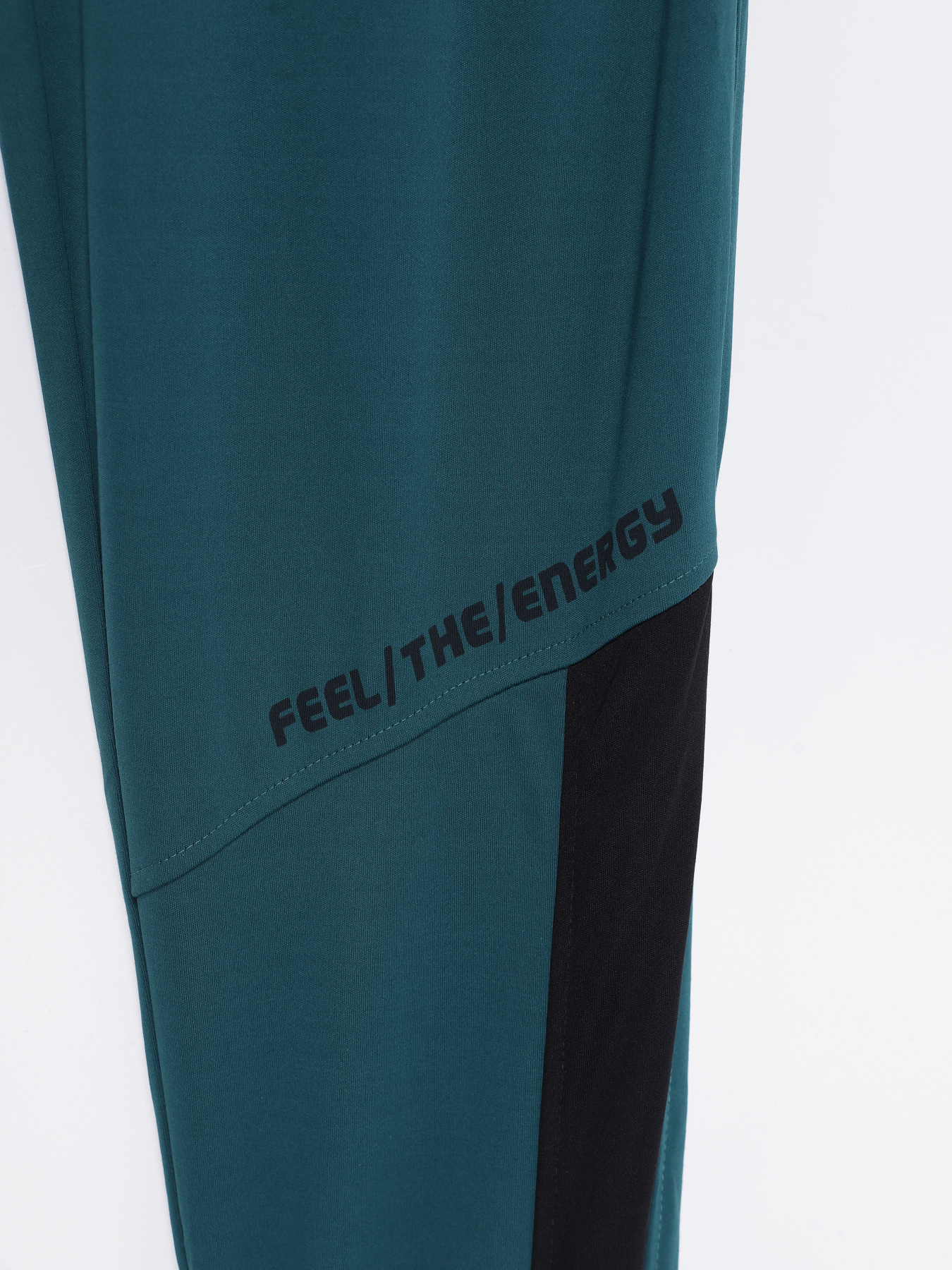 Спортивні штани Crivit модель IAN3016865_т.бірюзовий з чорним Фото