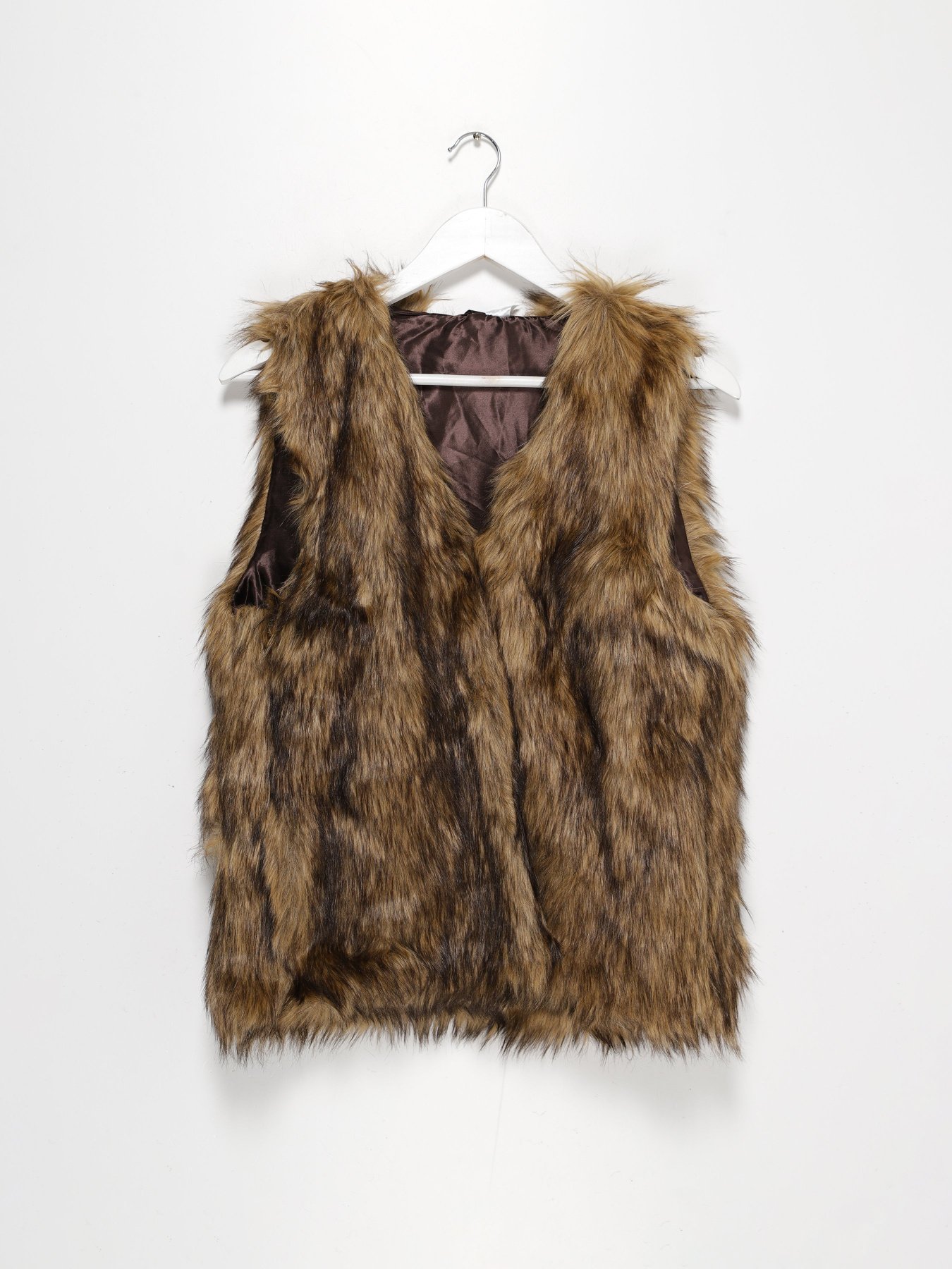 Жилет з утеплювачем H&M модель 0647431_с.коричневий комб. Фото