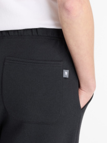 Спортивні штани New Balance REIMAGINED модель WP53505BK Фото