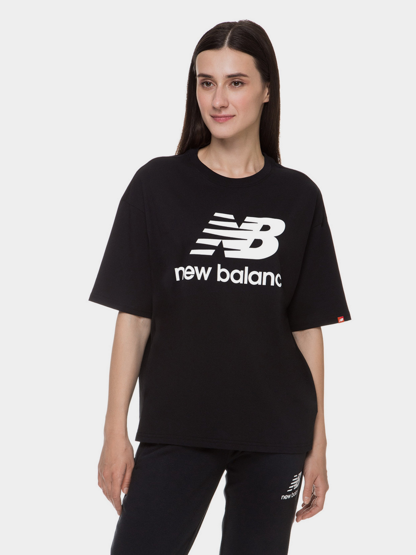 Спортивна футболка New Balance Essentials Stacked Logo модель WT03519BK Спортивна футболка New Balance Essentials Stacked Logo модель WT03519BK Фото