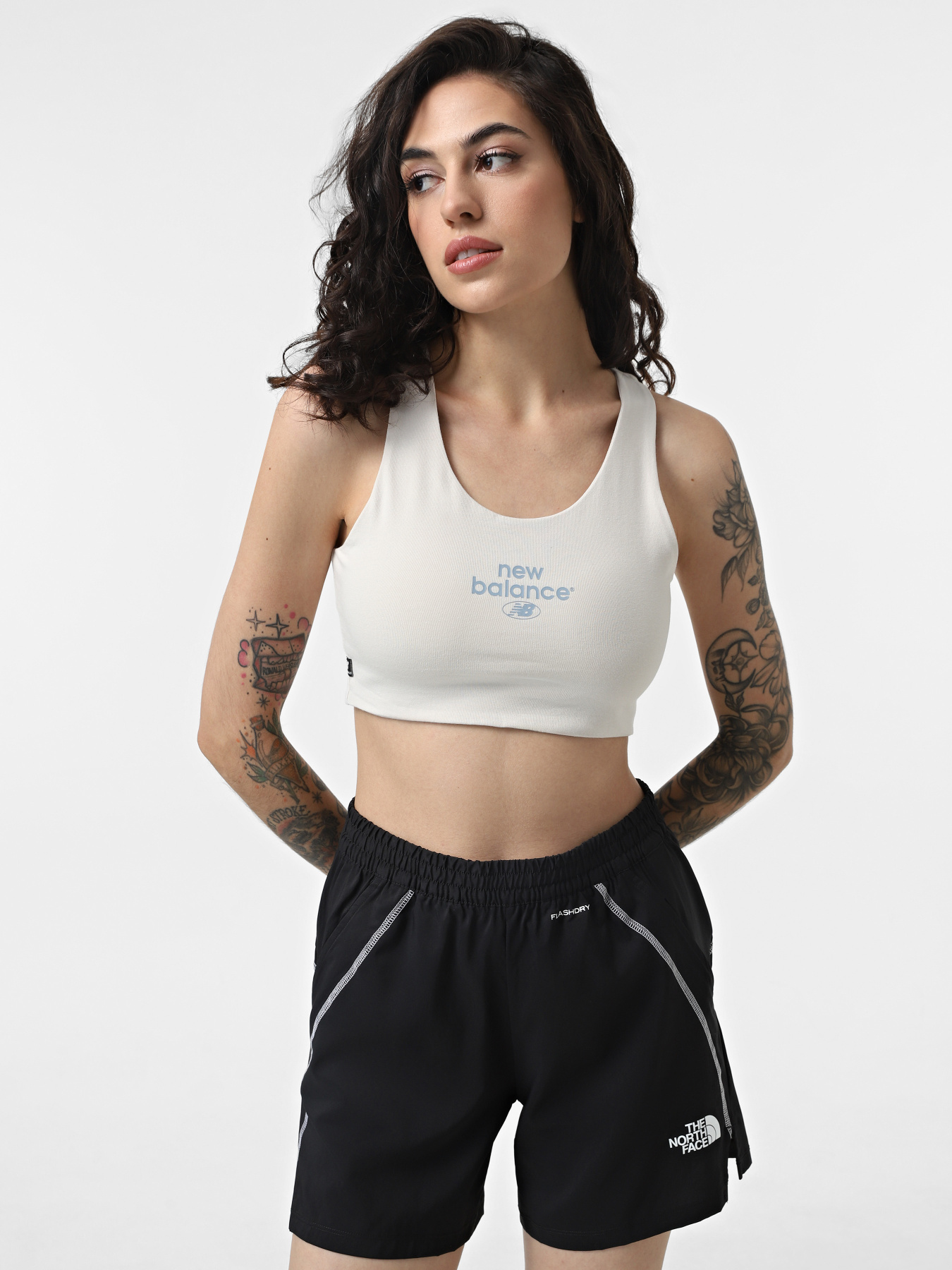 Спортивный топ New Balance Essentials Reimagined модель WB31500MBM Спортивный топ New Balance Essentials Reimagined модель WB31500MBM Фото