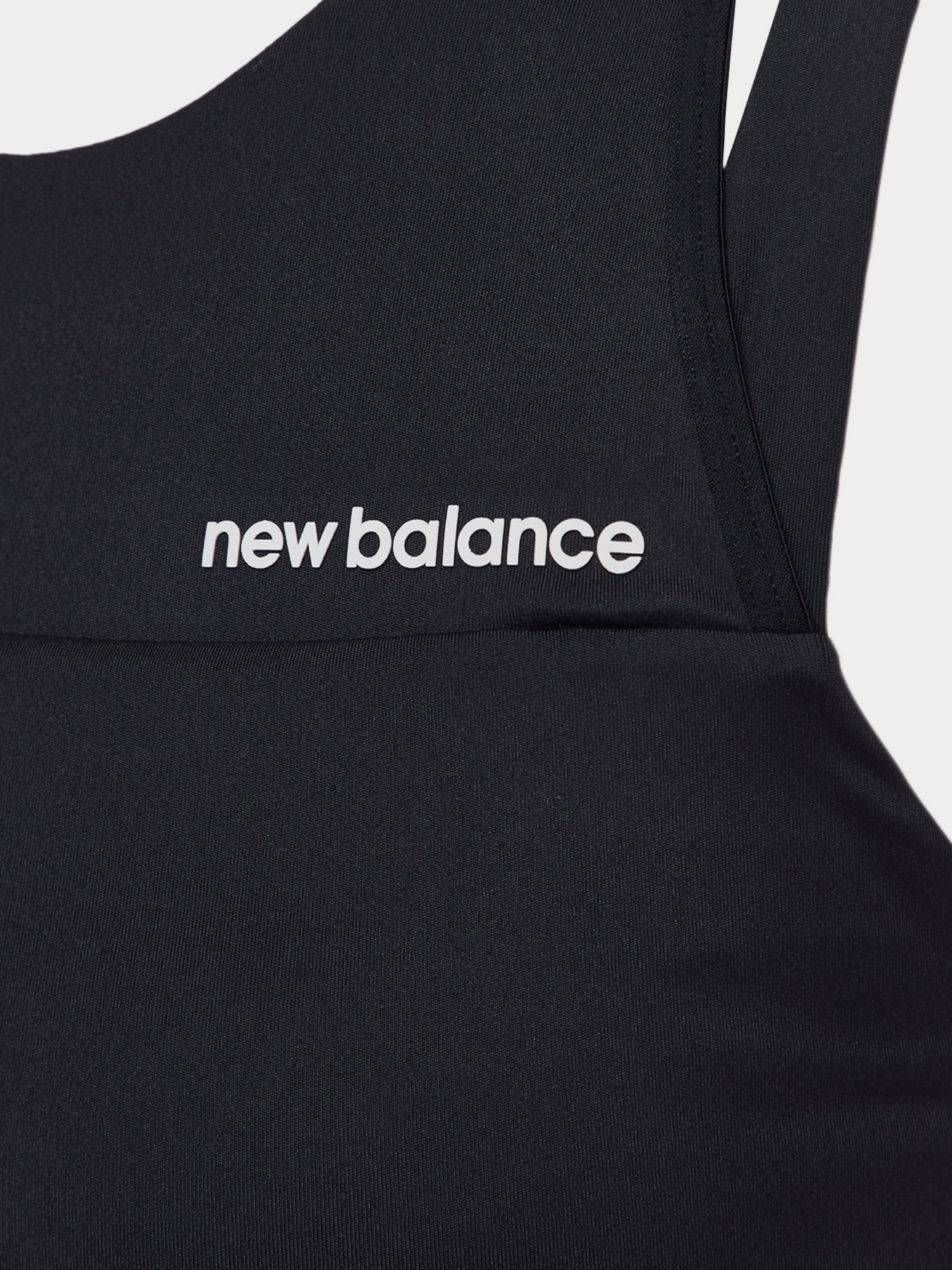 Спортивний топ New Balance Shape Shield модель WB21110BK Фото