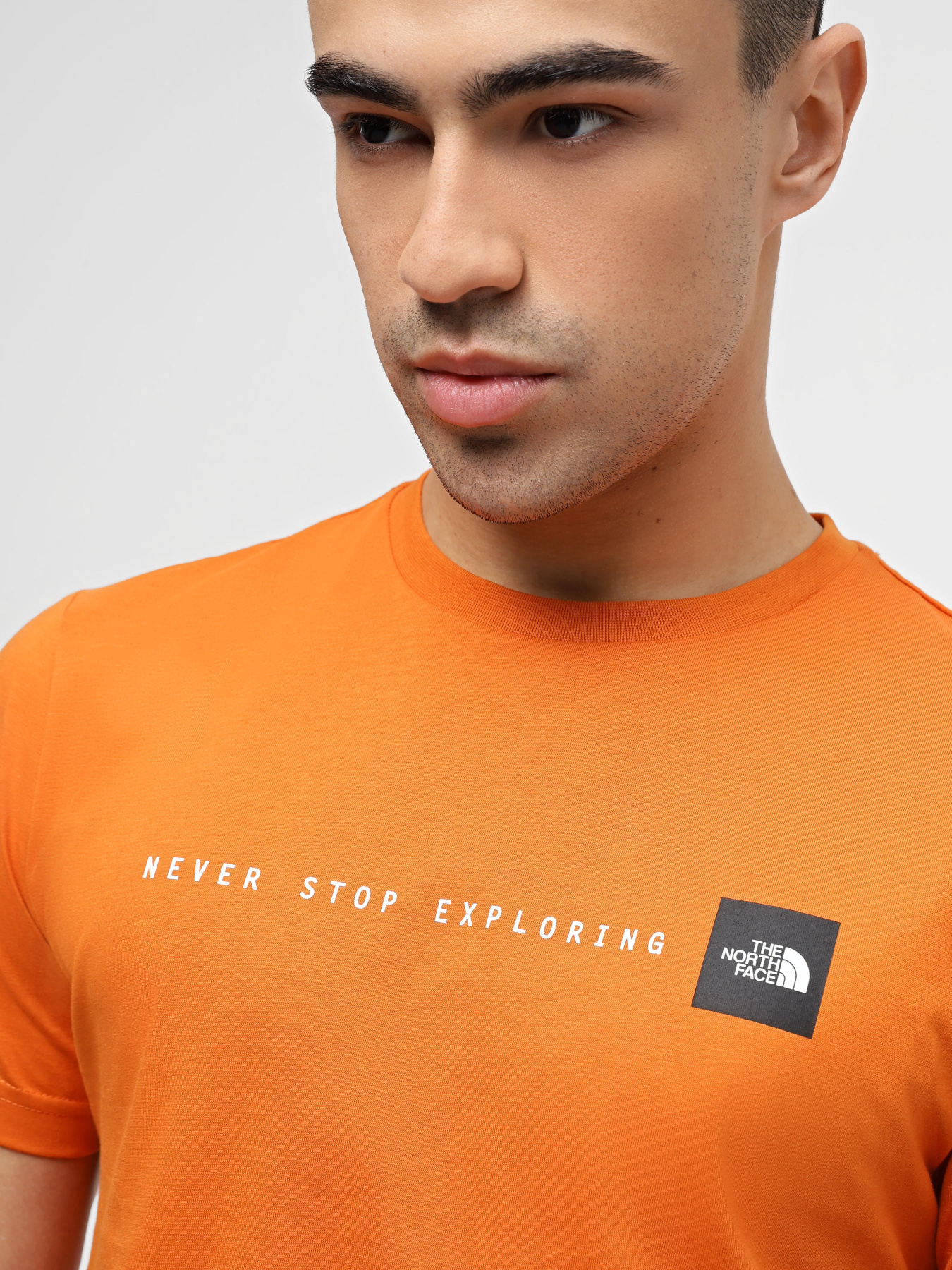 Футболка The North Face Never Stop Exploring модель NF0A87NSPCO1 Футболка The North Face Never Stop Exploring модель NF0A87NSPCO1 Фото