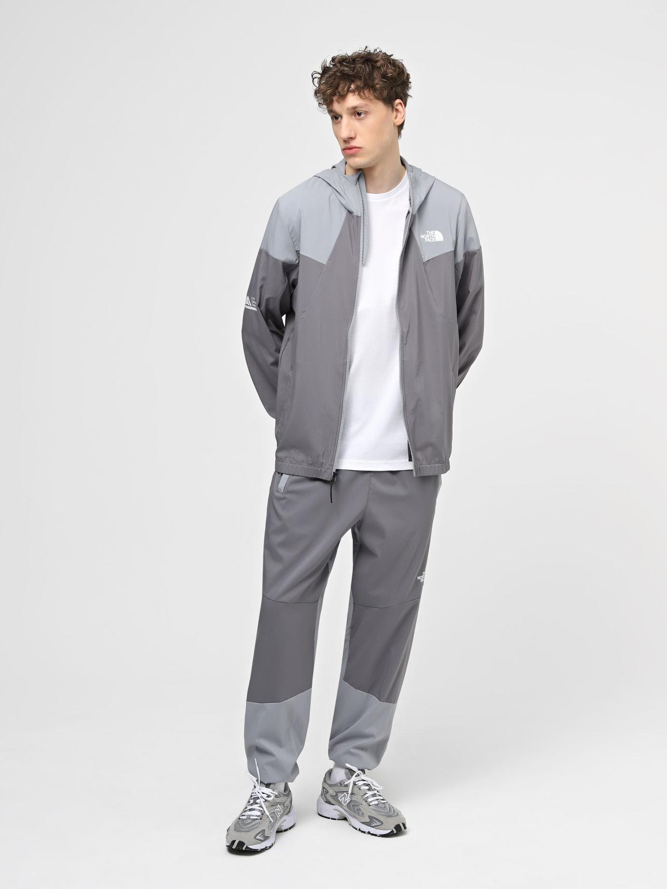 Спортивні штани The North Face M Ma Wind Track Pant модель NF0A87J6W2O1 Фото