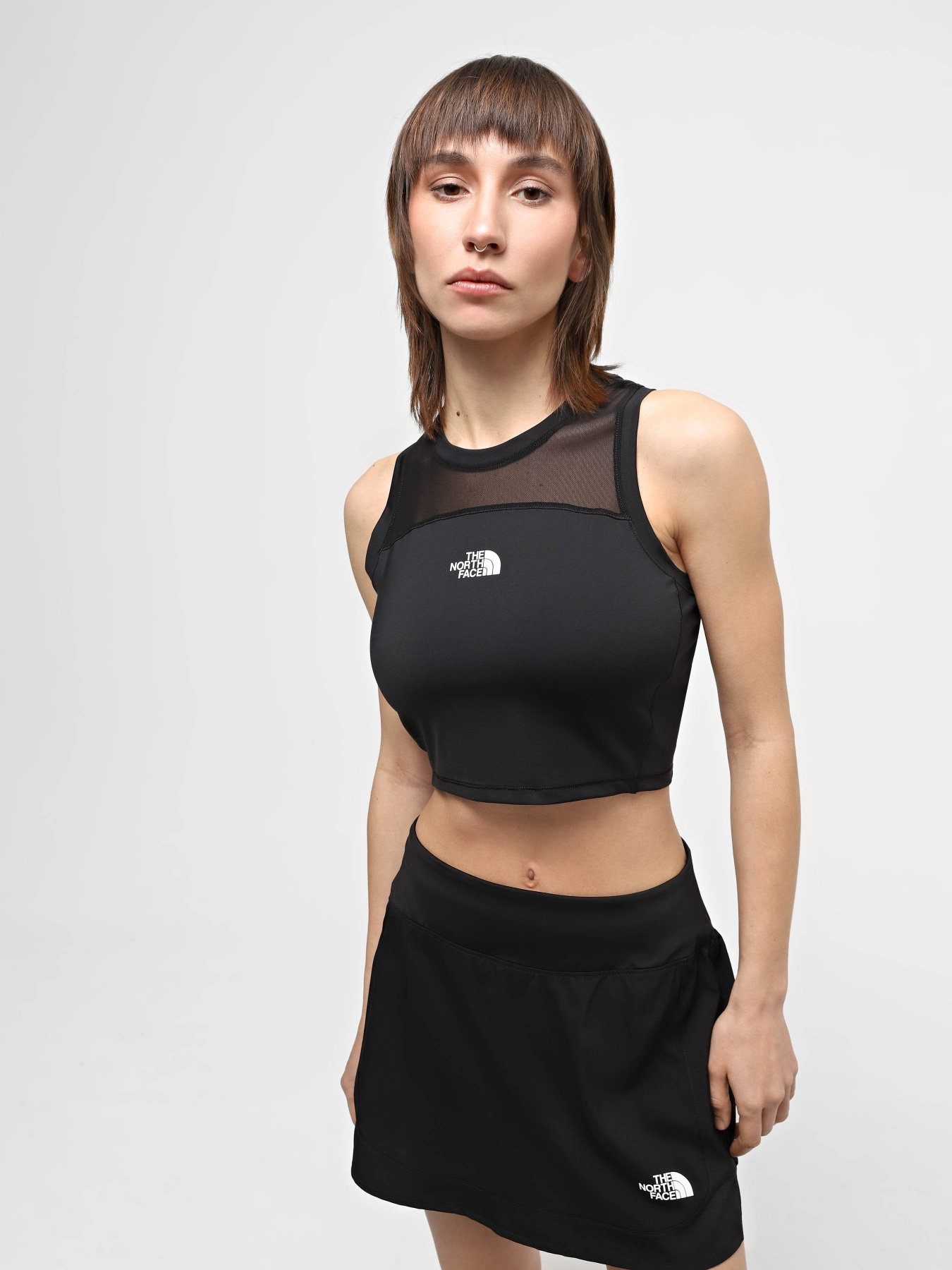 Топ The North Face W Movmynt Tiny Tank модель NF0A8815JK31 Топ The North Face W Movmynt Tiny Tank модель NF0A8815JK31 Фото
