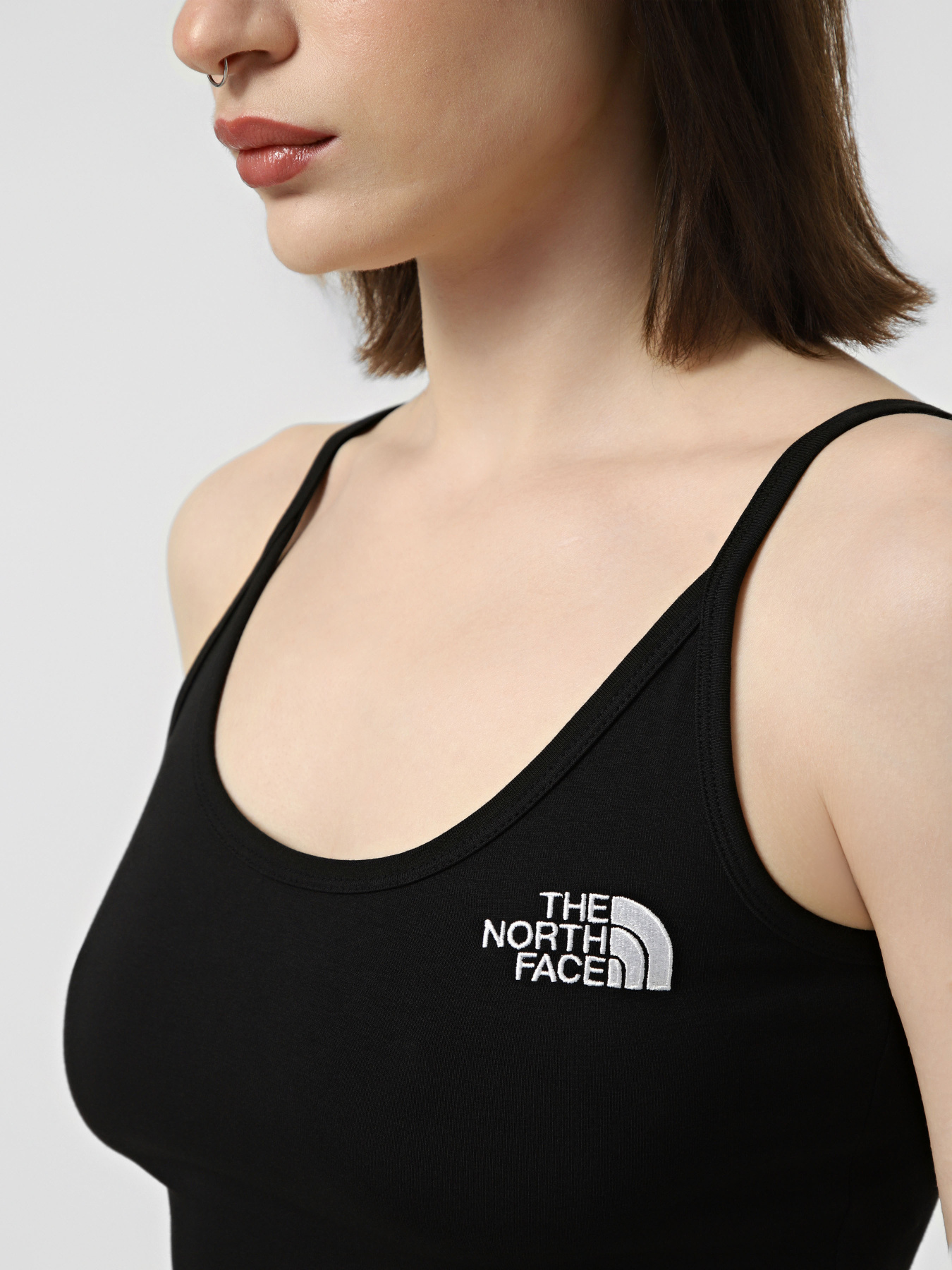Футболки и поло The North Face W SIMPLE DOME SLIM CROP TANK модель NF0A55AQJK31 Фото