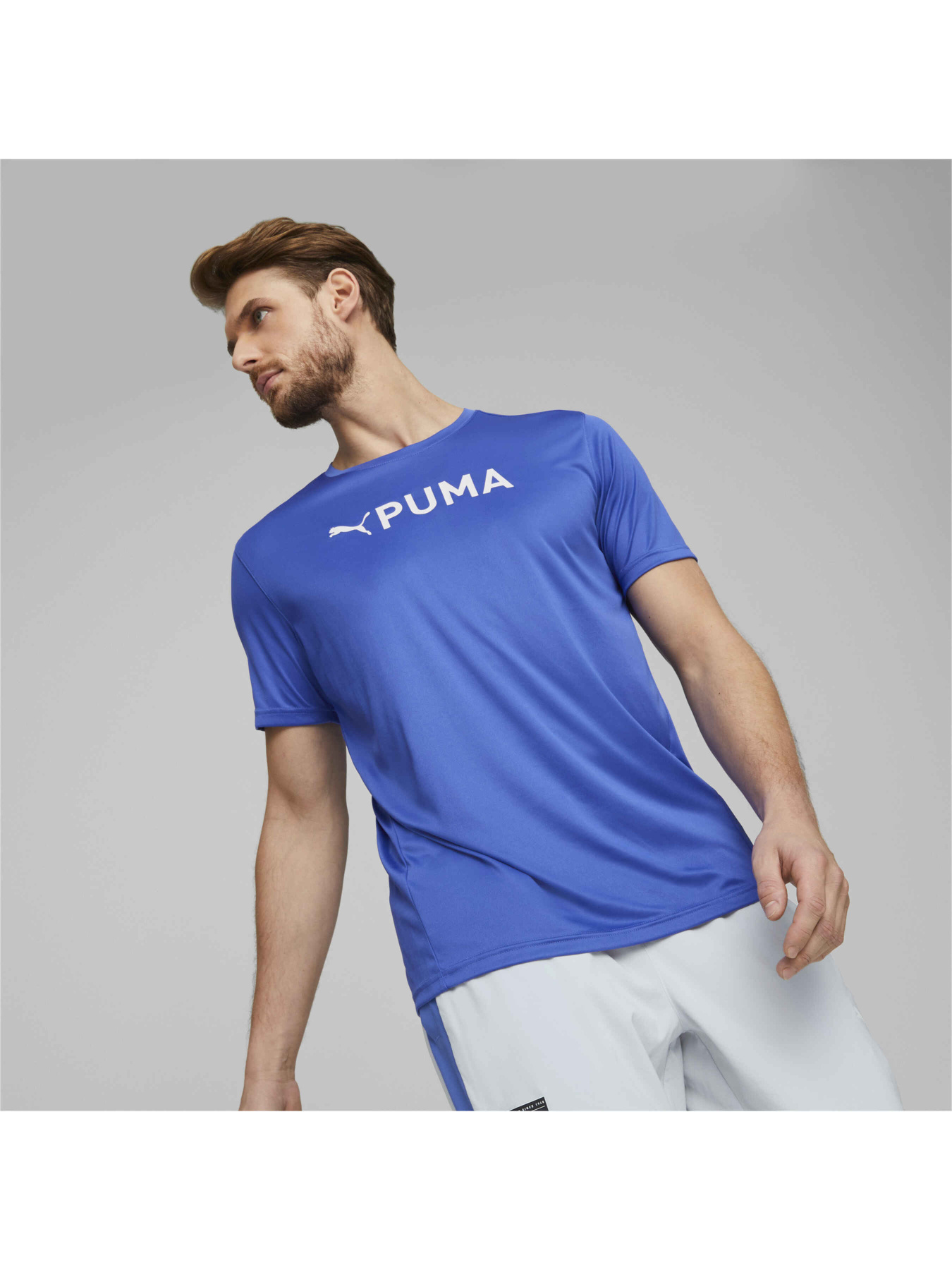Спортивная футболка PUMA Fit Logo Tee Graphic модель 523098 Спортивная футболка PUMA Fit Logo Tee Graphic модель 523098 Фото