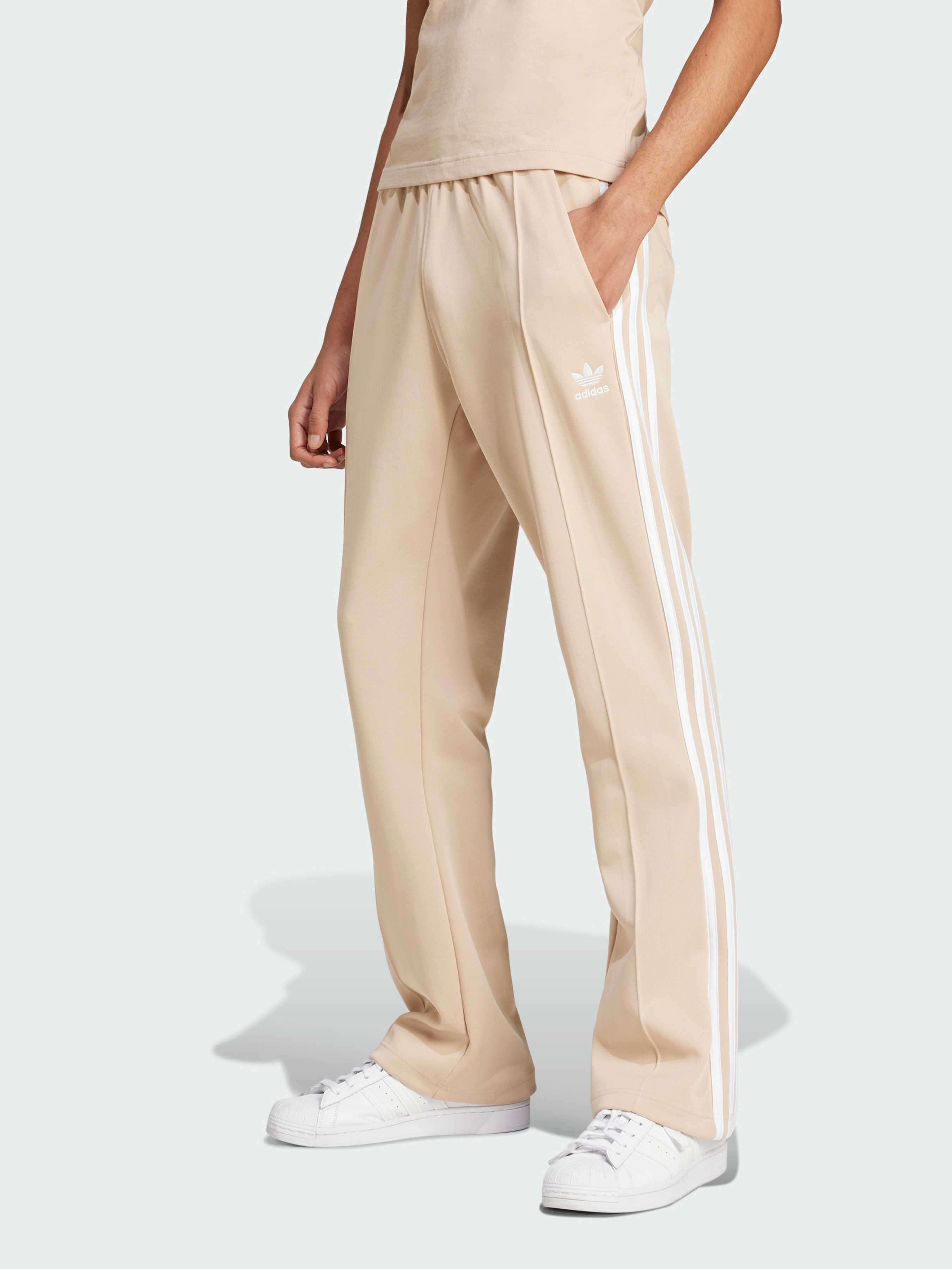 Бавовняні Чоловічі Повсякденні штани adidas Культові силуети (IX5221) колір бежевий