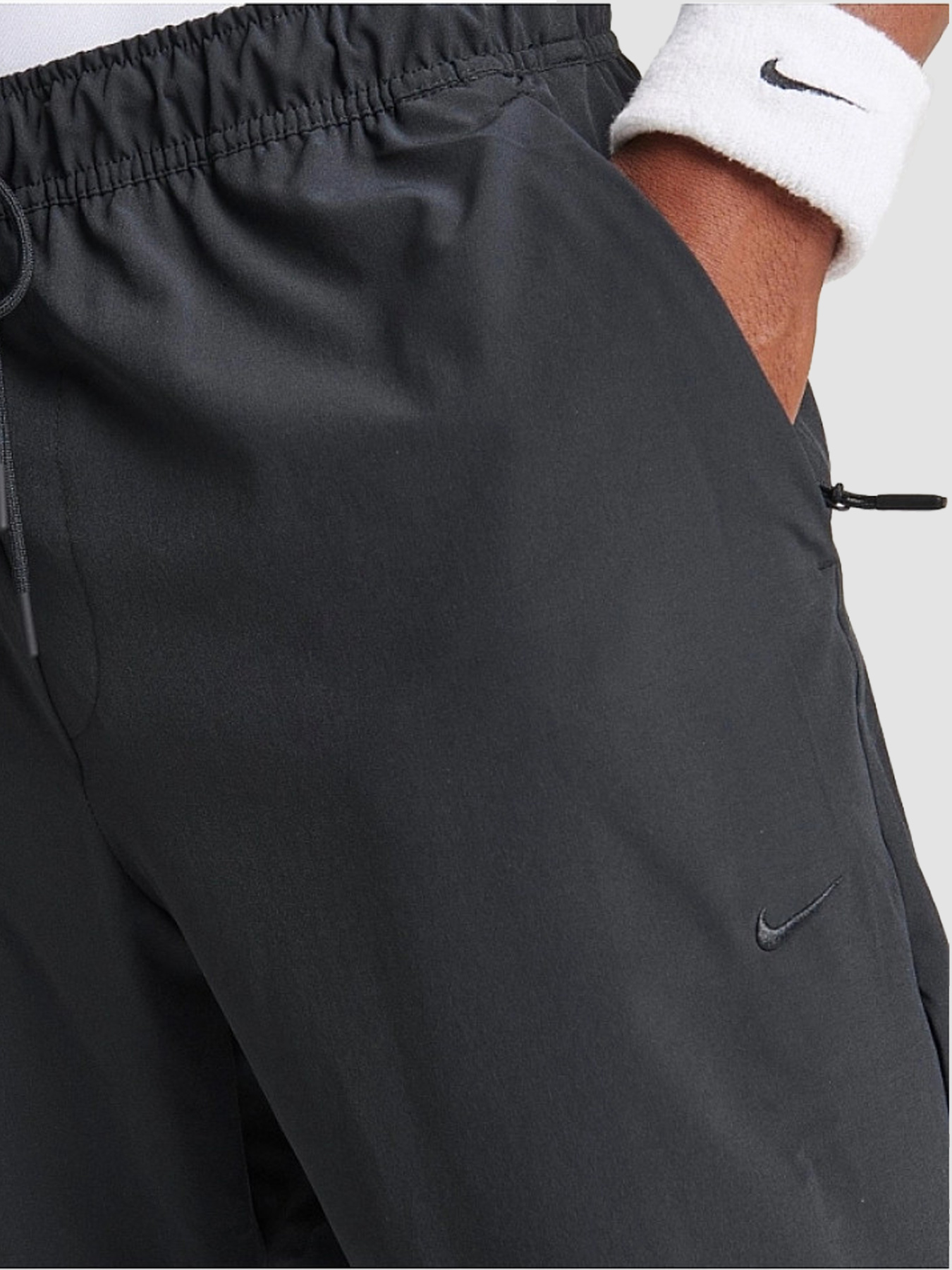 Штани повсякденні NIKE Dri-Fit Unlimited Tapered Leg модель FB7548-010 Фото