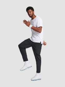 Штани повсякденні NIKE Dri-Fit Unlimited Tapered Leg модель FB7548-010 Фото