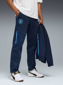 Штаны спортивные PUMA Mcfc Tech Sweatpants модель 782657 Штаны спортивные PUMA Mcfc Tech Sweatpants модель 782657 Фото