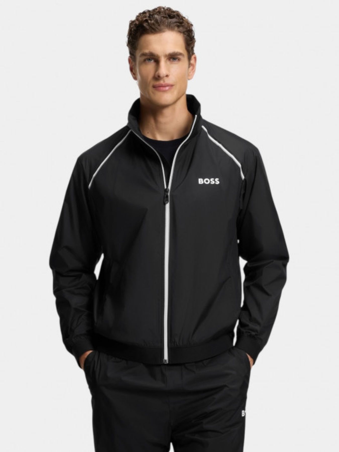 Чорний спортивний костюм LW_Match Tracksuit з водовідштовхувальним покриттям модель 11338 Чорний спортивний костюм LW_Match Tracksuit з водовідштовхувальним покриттям модель 11338 Фото