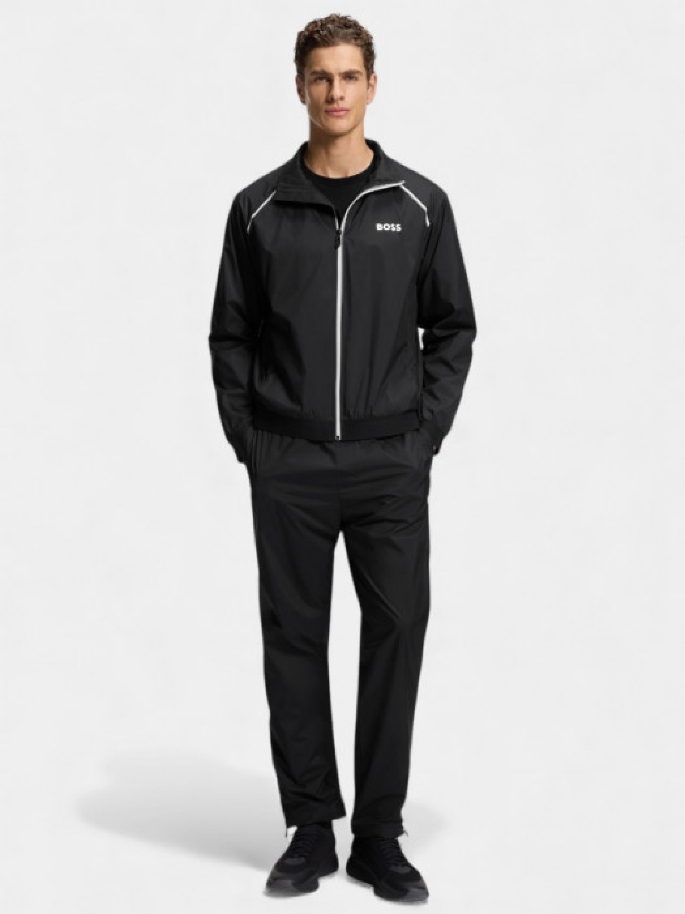 Чорний спортивний костюм LW_Match Tracksuit з водовідштовхувальним покриттям модель 11338 Чорний спортивний костюм LW_Match Tracksuit з водовідштовхувальним покриттям модель 11338 Фото